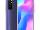 the back of a purple and blue smartphone with a picture of an abstract background