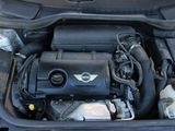 the engine of a car with its hood open and the hood down