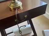 a lamp that is sitting on a table with a lamp on it