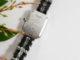 an image of a wrist watch with a chain around it