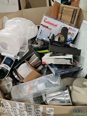 a cardboard box full of various items in it