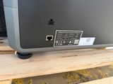a close up of a television on top of a wooden table