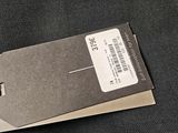 a box with a barcode on it sitting on a black cloth