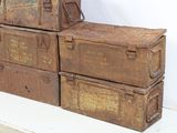 four old metal boxes stacked on top of each other