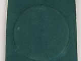 an image of a green square with a silver ring on it