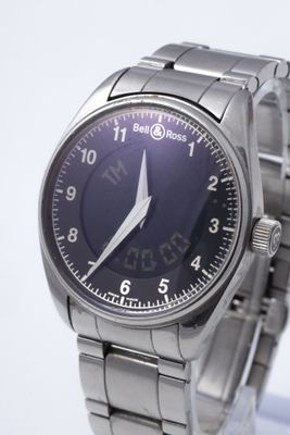 a close up of a wrist watch with a blue face