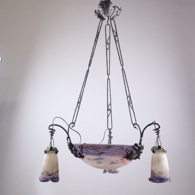 a chandelier hanging from the ceiling in a room