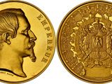a close up of a gold coin with an image of a man