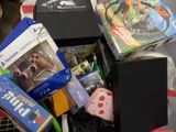a pile of toys and games in a shopping cart