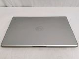 the laptop is sitting on a white surface with a white background