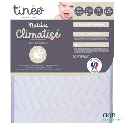 a close up of a baby mattress with a label on it