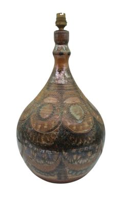 a brown and black vase on a white background