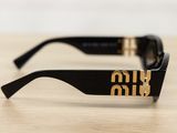 the sunglasses are black and gold with a logo on the side