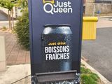 a sign for a restaurant on the side of the street