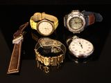 a lot of watches that are sitting on a table