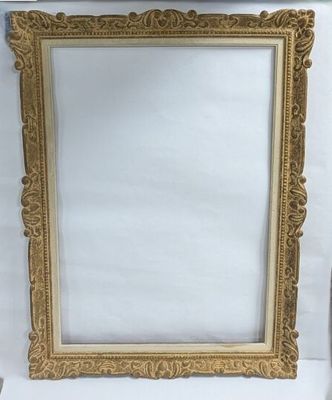 an antique gold picture frame on a white background