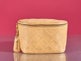 an image of a purse on a table with a pink background