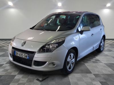 a picture of a silver car parked in a garage