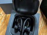an image of a pair of headphones in a box on a wooden floor