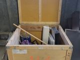 a wooden box that has a lot of stuff inside of it