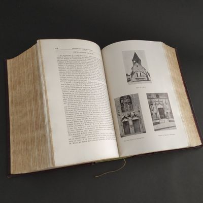 an open book on a table with pictures on it