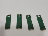 three pieces of circuit board sitting next to each other on a table