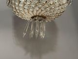 a close up of a chandelier hanging from a ceiling in a room