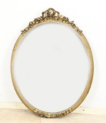 an image of a gold framed mirror sitting on top of a wooden floor