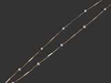 a gold necklace with pearls and a star