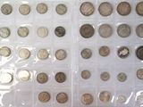 a lot of coins that are in a plastic case