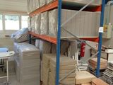 a room with a lot of boxes and boxes on the shelves