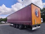 a large semi truck that is parked in a parking lot