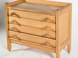 a small wooden chest of drawers on a white background