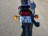 a motorcycle that is parked on the side of the road