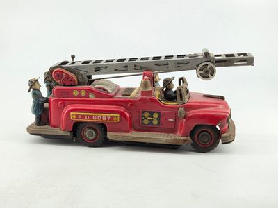 a toy fire truck with a ladder on the back