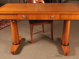 a wooden desk with two drawers and a chair in front of it