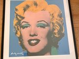 framed photograph of marilyn monroe with blue eyes and yellow hair
