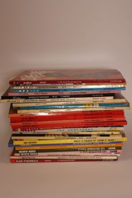 a lot of books stacked on top of each other