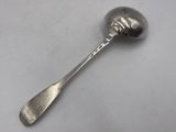 silver plated spoon with a spoon shaped like a skull on it