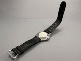 an image of a wrist watch with a leather band on a table