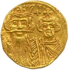 une pièce d'or sur laquelle figurent un homme et une femme