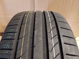 a close up of a tire on a wooden surface