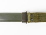 a knife that is laying on top of a piece of cloth