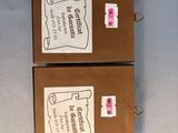 two brown boxes with labels on them sitting on a table