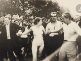 a black and white photo of a group of people dancing