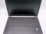 a laptop that is open on a white surface
