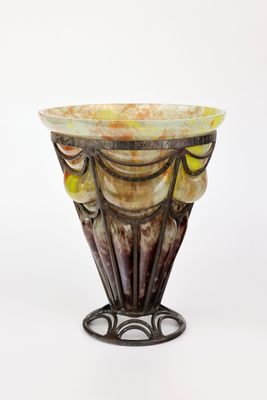 a glass vase that is sitting on a stand