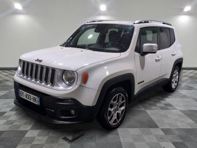 the white jeep is parked on a checkered floor in the garage