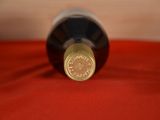 a bottle of wine that is sitting on a table