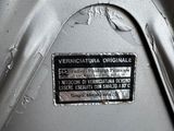 a close up of a metal object with a label on it